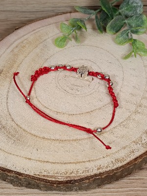 Pletený náramek se čtyřlístkem a korálky